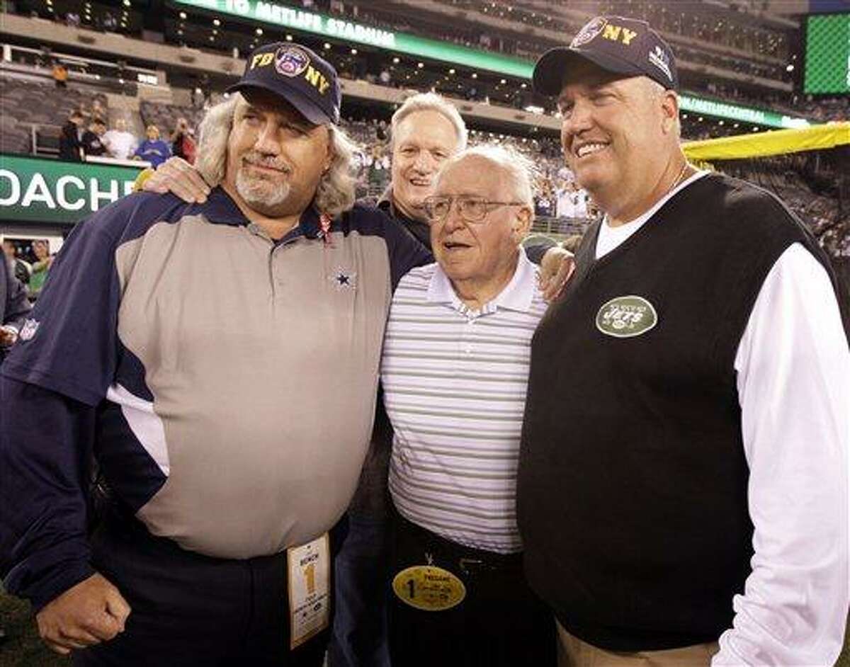New York Jets head coach Rex Ryan, right, poses with his father Buddy Ryan and his brother Dallas Cowboys defensive coordinator Rob Ryan, left, before an NFL football game Sunday, Sept. 11, 2011, in East Rutherford, N.J. (AP Photo/Julio Cortez)