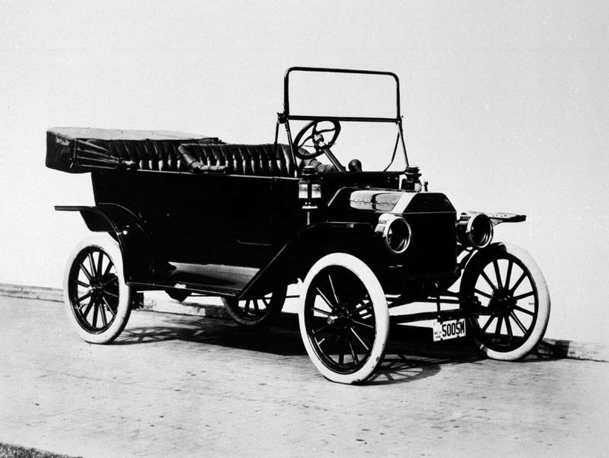 The 1914 Ford Model T touring car is shown in this Ford Motor Co. handout. Perhaps the most famous vehicle ever produced, the "Tin Lizzie" chugged into history in 1908 and became the symbol of low-cost, reliable transportation. The 1914 model was the first version built on Henry Ford's movng assembly line. (AP Photo/Ford Motor Co.)