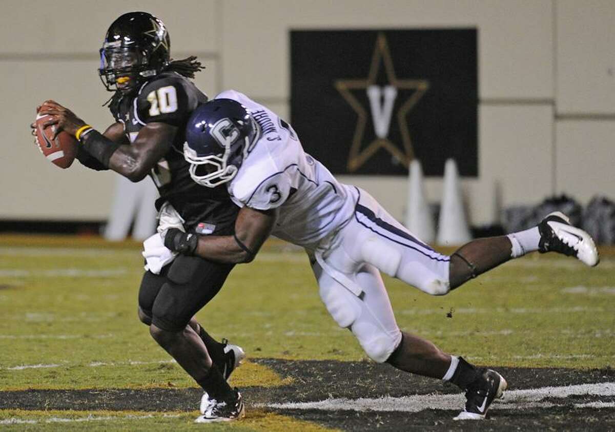Connecticut linebacker Sio Moore (3) sacks Vanderbilt quarterback Larry Smith in the second quarter of an NCAA college football game on Saturday, Sept. 10, 2011, in Nashville, Tenn. (AP Photo/John Russell)