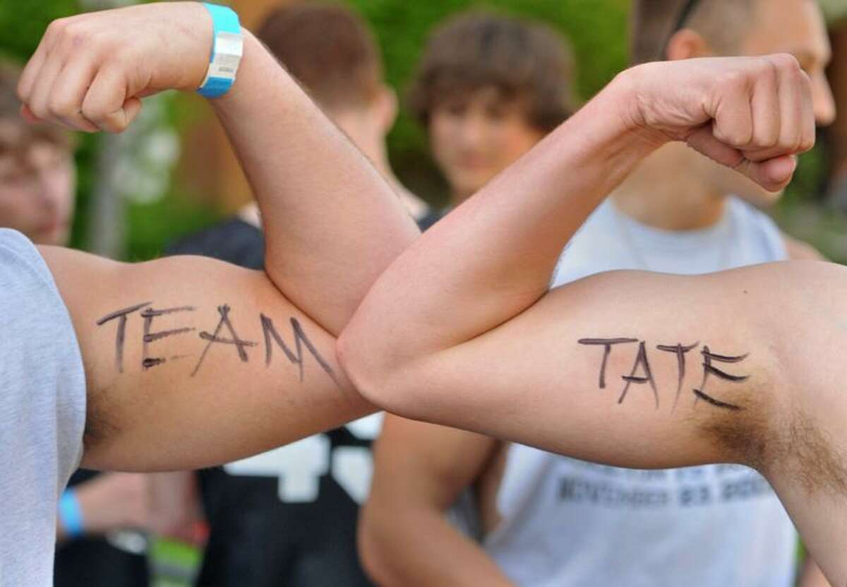 Two Shelton High School lacrosse players show their support for James Tate. Brad Horrigan/Register