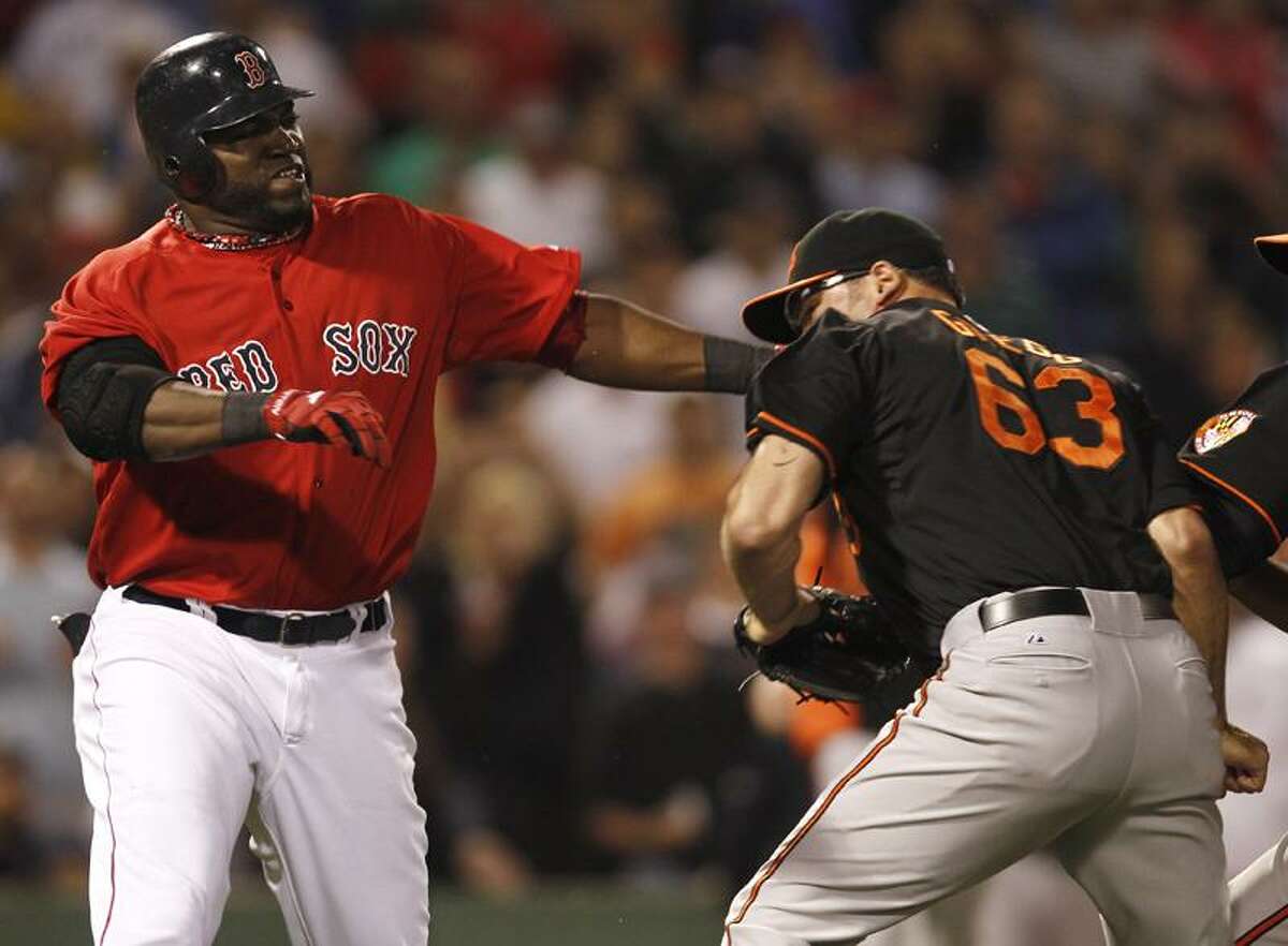 Kevin Youkilis charges the mound after being hit 