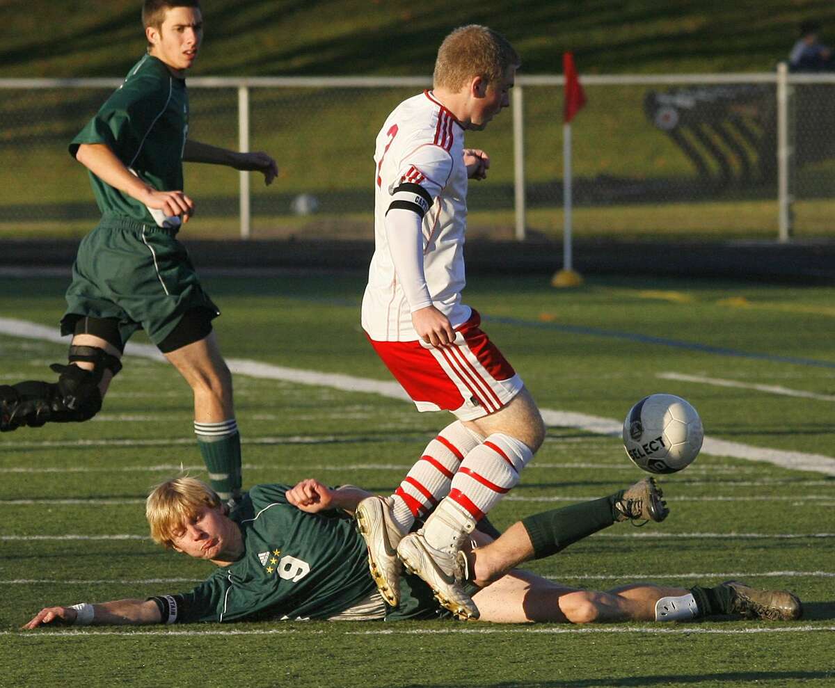 Dispatch Staff Photo by JOHN HAEGER twitter.com/oneidaphoto Hamiltom's Sam Owens (9) makes a clean slide tackle to take the ball away from Cincinnatus Cody Warner (6) in the first half of the Sec III final at Chittenango on Saturday, Nov. 5, 2011.