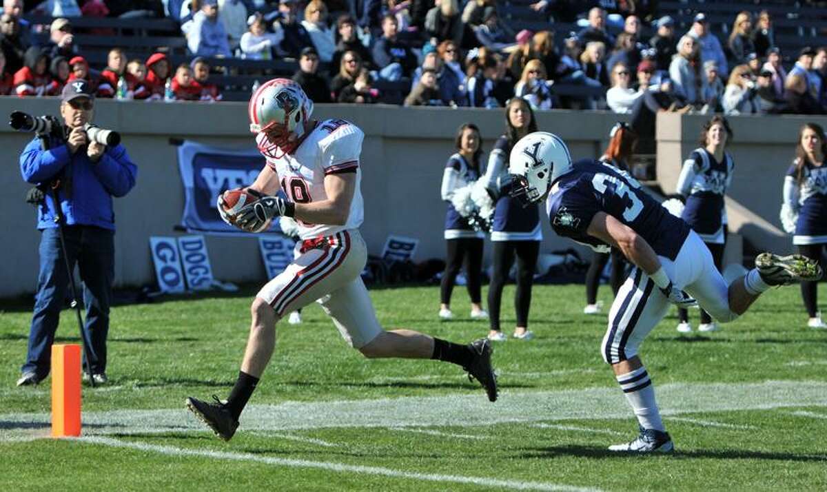 Wide receiver Jimmy Saros of Brown University scores a touchdown after beating Yale Strong Safety John Powers during second quarter football action at Yale Bowl Saturday 11/5/11. Photo by Peter Hvizdak / New Haven Register November 5, 2011 ph2401 Connecticut