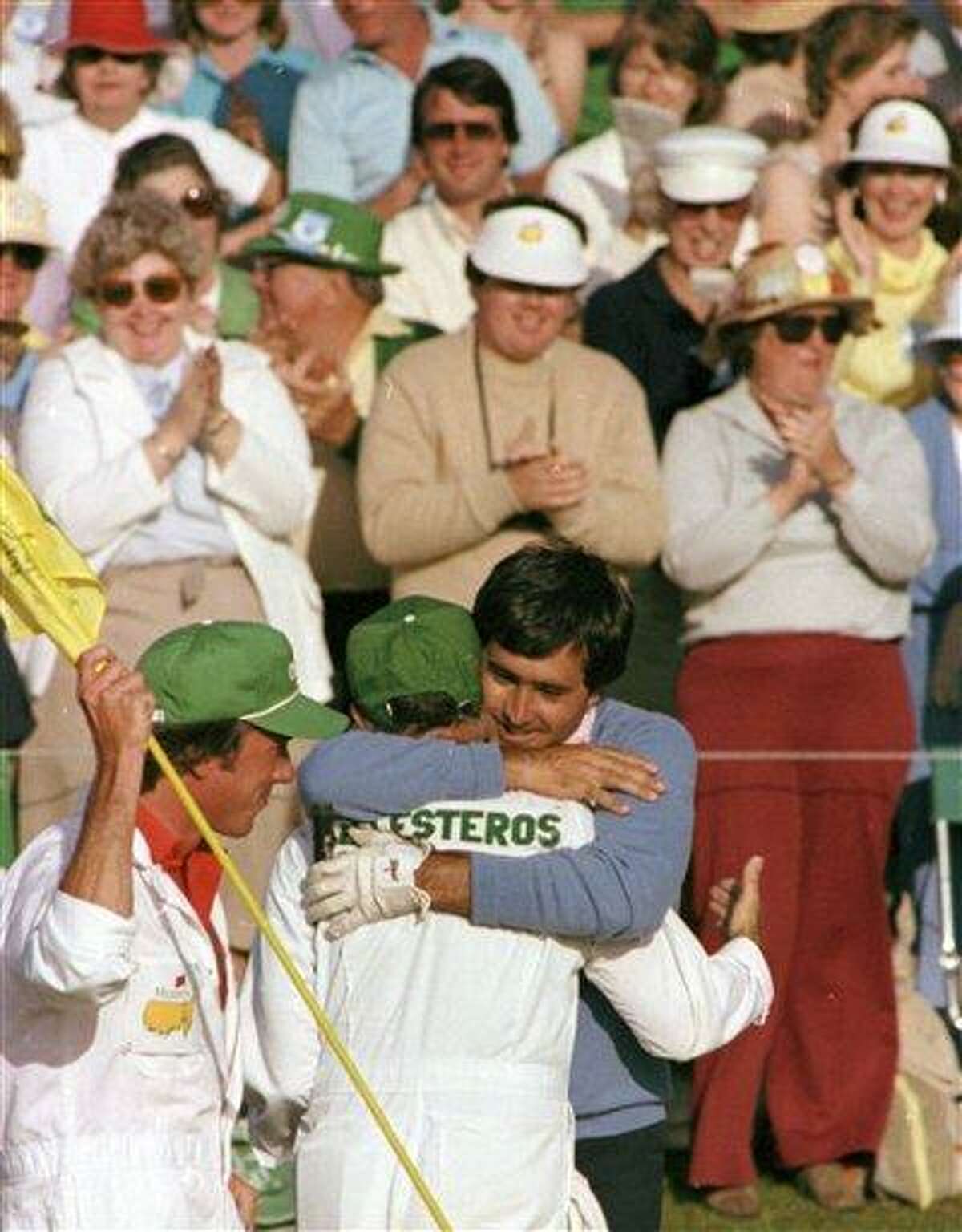 FILE - In this April 11, 1983 file photo, Seve Ballesteros, right, hugs his caddie after winning the Masters golf tournament in Augusta, Ga. Ballesteros died early Saturday, May 7, 2011, from complications of a cancerous brain tumor. He was 54. (AP Photo/File)