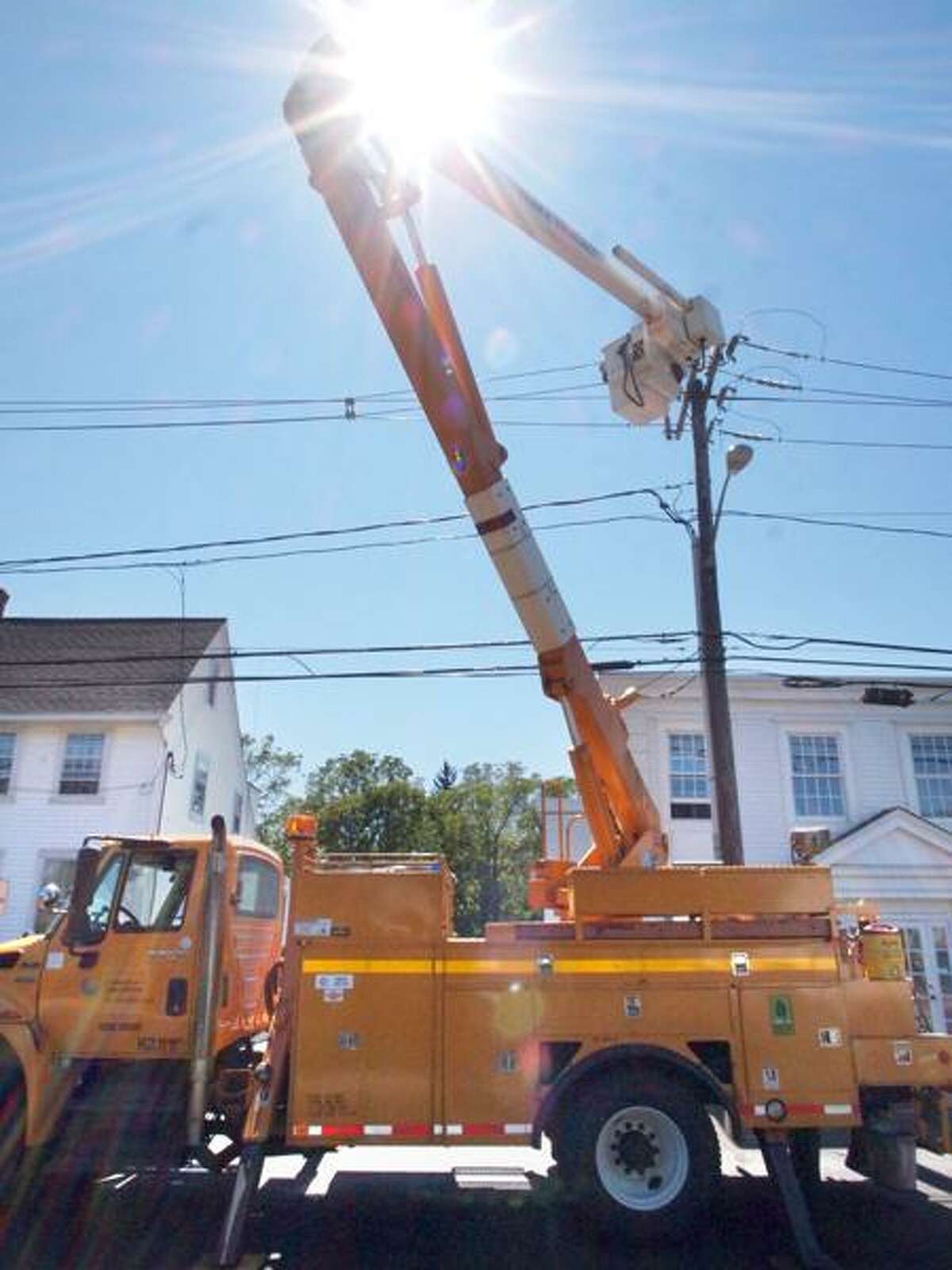 A Connecticut Light & Power crew works on power lines last week following Hurricane Irene. VM Williams/Register