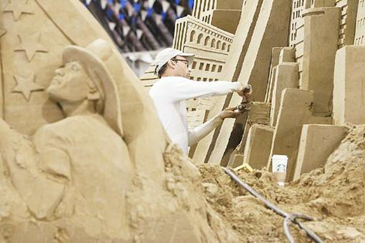 Dispatch Staff Photo by JOHN HAEGER (Twitter.com/OneidaPhoto) Patrick Harsch of Team Sandtastic works on a section of the 9/11 tribute sand sculpture at the NYS Fair on Friday, Aug. 26, 2011.