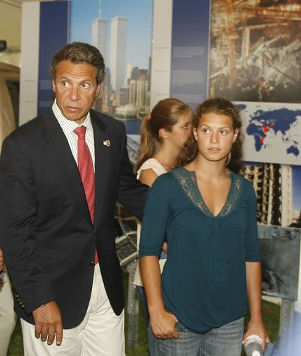 Dispatch Staff Photo by JOHN HAEGER (Twitter.com/OneidaPhoto)New York Gov. Andrew Cuomo and his daughters look at a timeline of the 9/11 attacks at the New York State Fair in Geddes on opening day on Thursday, Aug. 25, 2011. The fair runs through Labor Day.