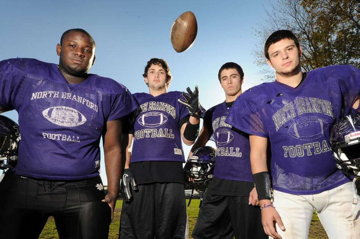 North Branford football captains Damoy Hunter, Cory Onofrio, Christian Perrotti and Anthony Franco pose for a picture at the North Branford football practice field Tuesday Oct 25, 2011. VM Williams