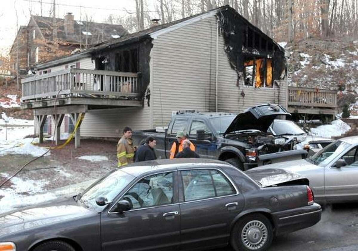 Fire investigators on the scene on Warner Rd. in East Haven. Photo by Mara Lavitt/New Haven Register1/3/11