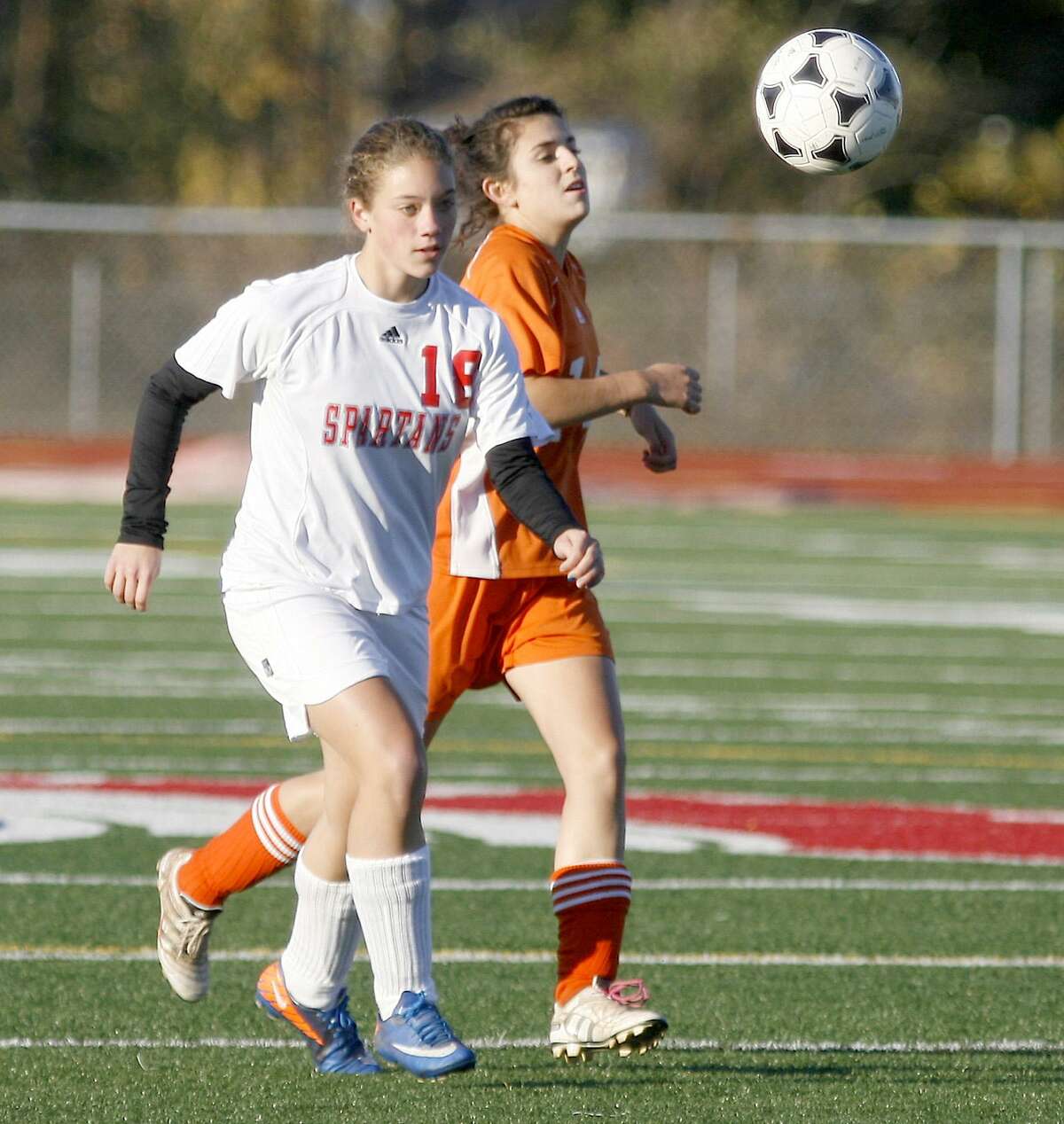 Dispatch Staff Photo by JOHN HAEGER twitter.com/oneidaphoto New Hartford's Alysa Keady (18) and Oneida's Nicole DelPino (14) chase down the loose ball in the first half of the Sec III quarterfinal match in New Hartford on Tuesday, Oct. 25, 2011.