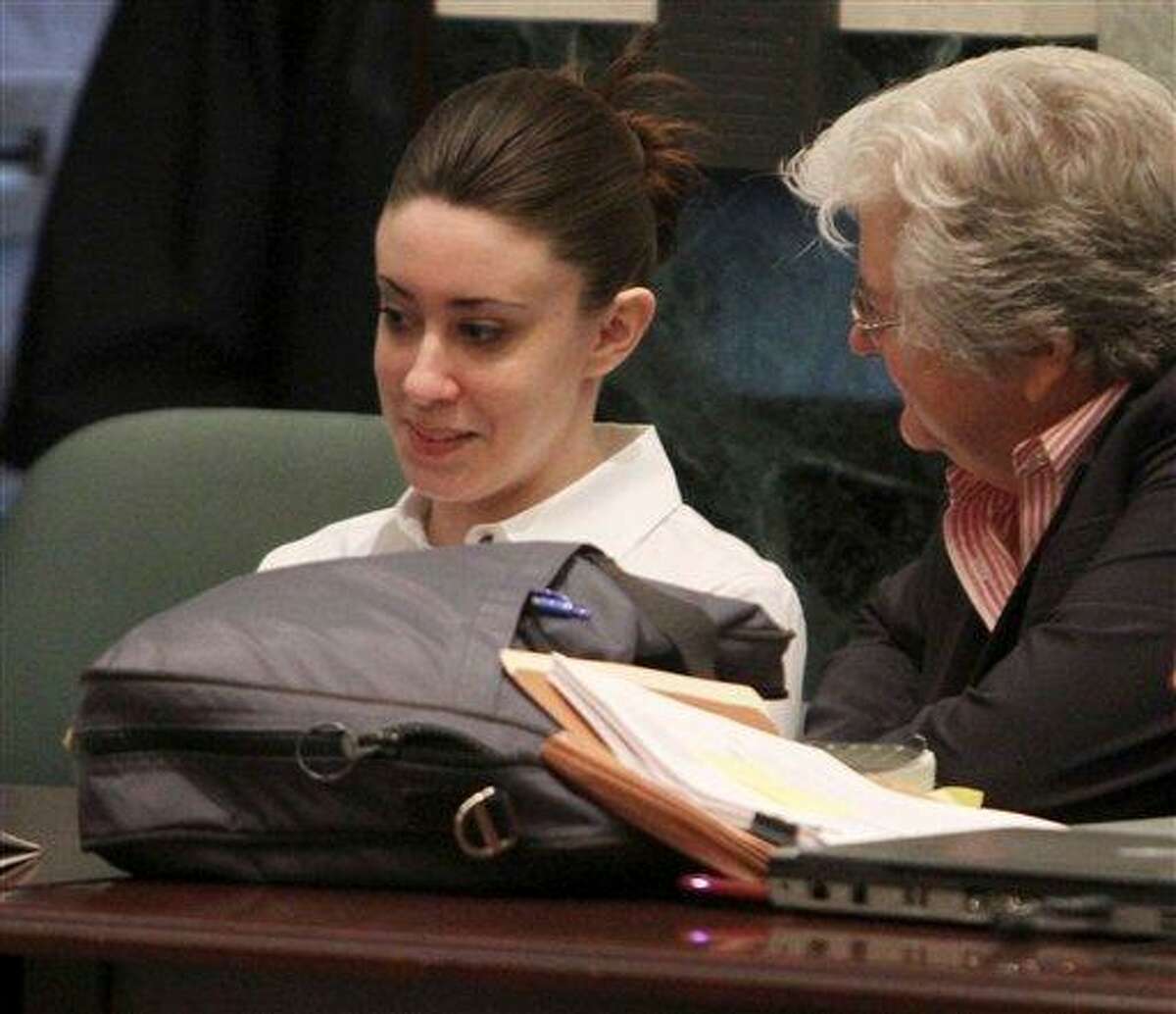 Casey Anthony, left, listens to her attorney Anne Finnell before the start of court in her murder trial at the Orange County Courthouse in Orlando, Fla. on Monday, June 27, 2011. Anthony, 25, is charged with the murder of her 2-year old daughter in 2008.(AP Photo/Red Huber,Pool)