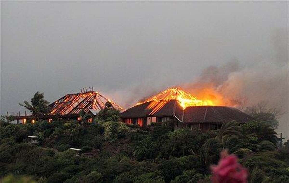 In this image issued Monday Aug. 22, 2011 by Virgin Limited Edition shows British entrepreneur's Sir Richard Branson's luxury home, on Necker Island, in the Caribbean, in flames as a fire which ripped through the luxury home. Guests including Academy Award-winning actress Kate Winslet escaped uninjured when fire destroyed Richard Branson's Caribbean home during a tropical storm Monday, said the British businessman. The Virgin Group boss said about 20 people, including Winslet and her children, were staying in the eight-bedroom Great House on Necker, his private isle in the British Virgin Islands. (AP Photo/Virgin Limited Edition/PA) UNITED KINGDOM OUT NO SALES NO ARCHIVE EDITORIAL USE ONLY