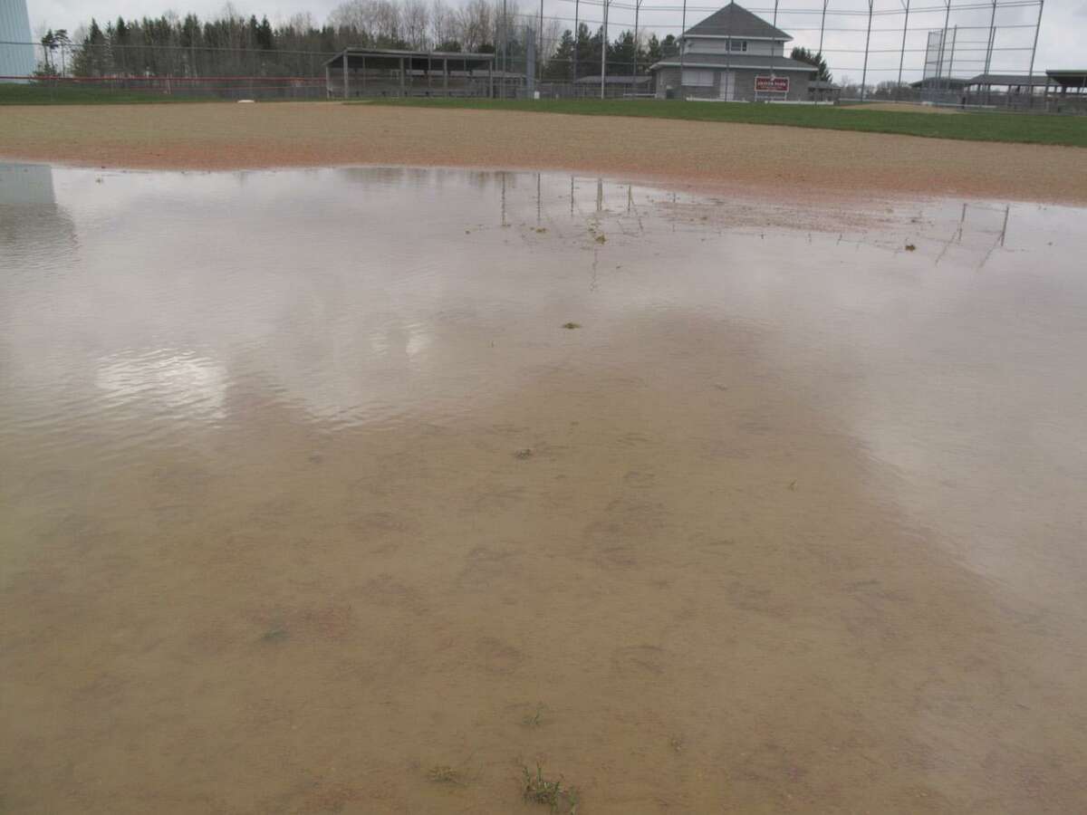 Dispatch Staff Photo by JOHN HAEGER Standing water between first and second base on the baseball infield at VVS' Oliver Park tells the story about how bad the weather has been during spring break.