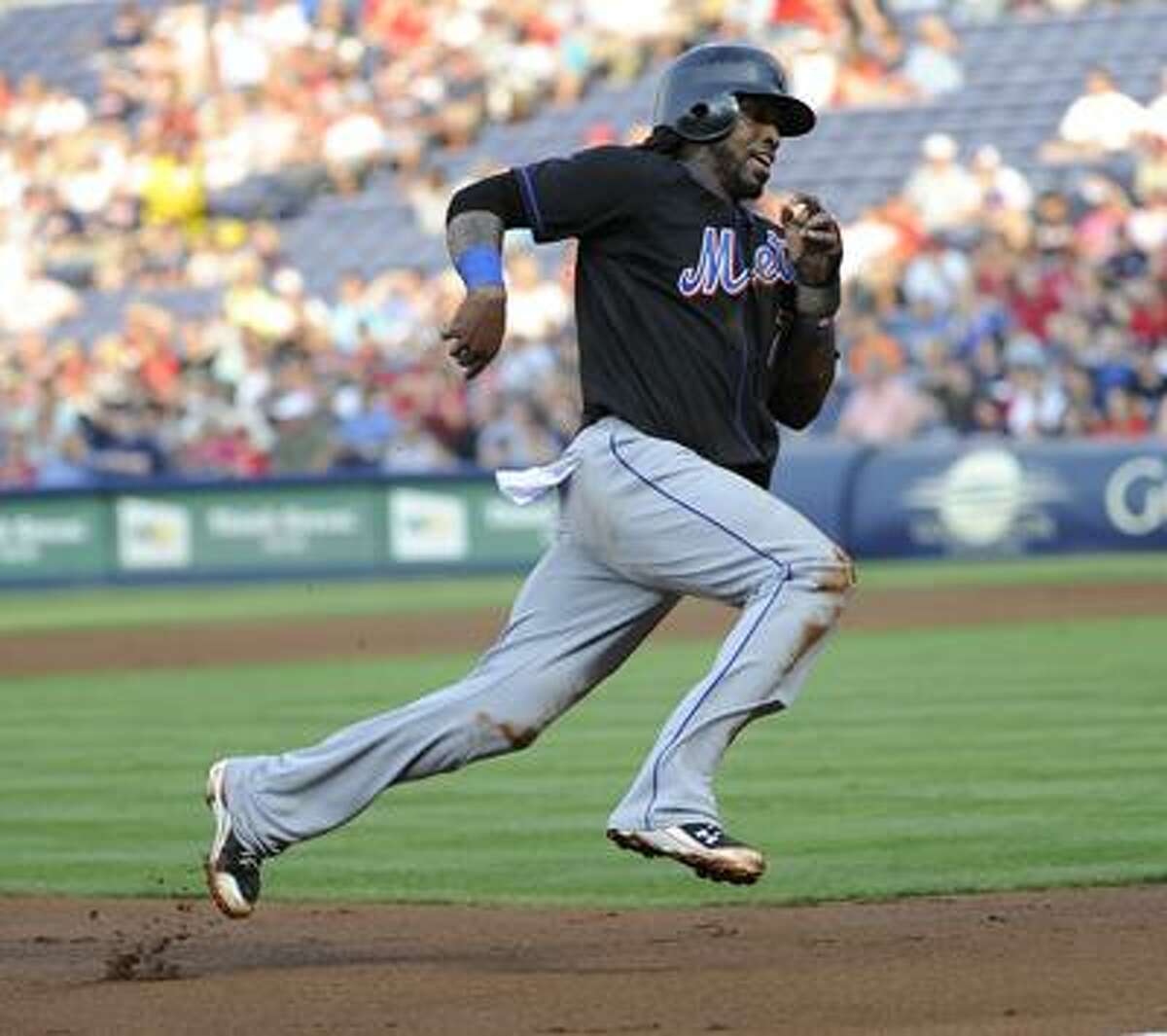 New York Mets Carlos Beltran rounds the bases after hitting a