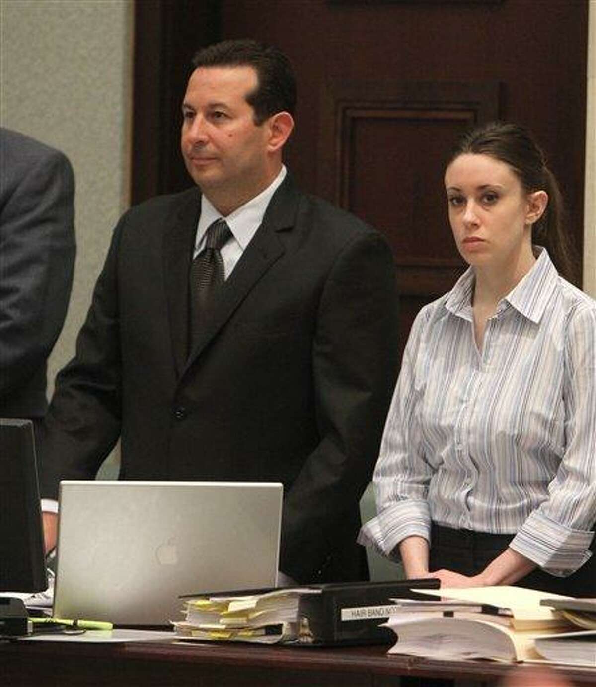 Attorney Jose Baez and his client Casey Anthony stand as the jury enters to courtroom for Anthony's trial at the Orange County Courthouse on Saturday, June 4, 2011 in Orlando, Fla. Anthony, 25, is charged with murder in the 2008 death of her daughter Caylee. If convicted, she could be sentenced to death. (AP Photo/Red Huber, Pool)