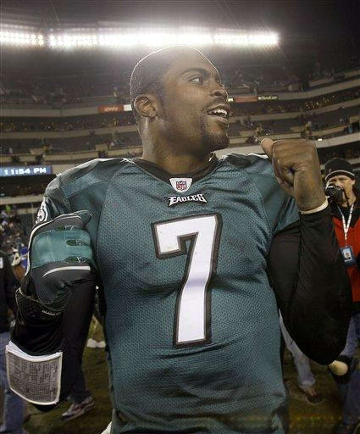 Philadelphia Eagles quarterback Michael Vick reacts to this team's victory as he leaves the field after an NFL football game against the New York Giants in Philadelphia, Monday, Nov. 22, 2010. The Eagles won 27 -17. (AP Photo/Matt Slocum)