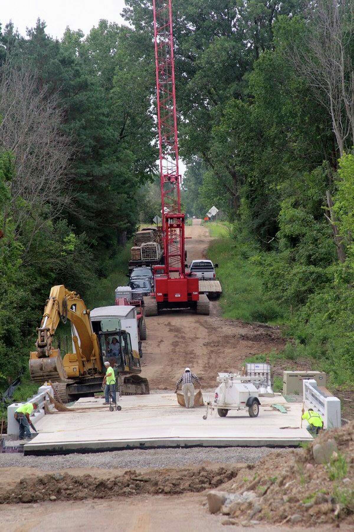 Work on the bridge over the Pigeon River on Blakely Road is nearing completion. The project began in late May, and should be finished in a month to six weeks. (Seth Stapleton/Huron Daily Tribune)
