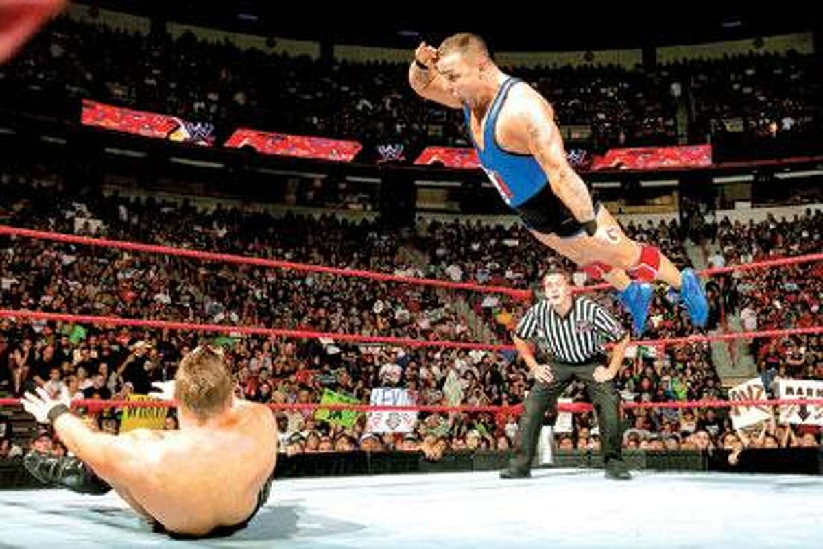 Rey Mysterio leaps over Dolph Zigler on WWE's "Friday Night SmackDown. (2009 World Wrestling Entertainment, Inc. All Rights Reserved)