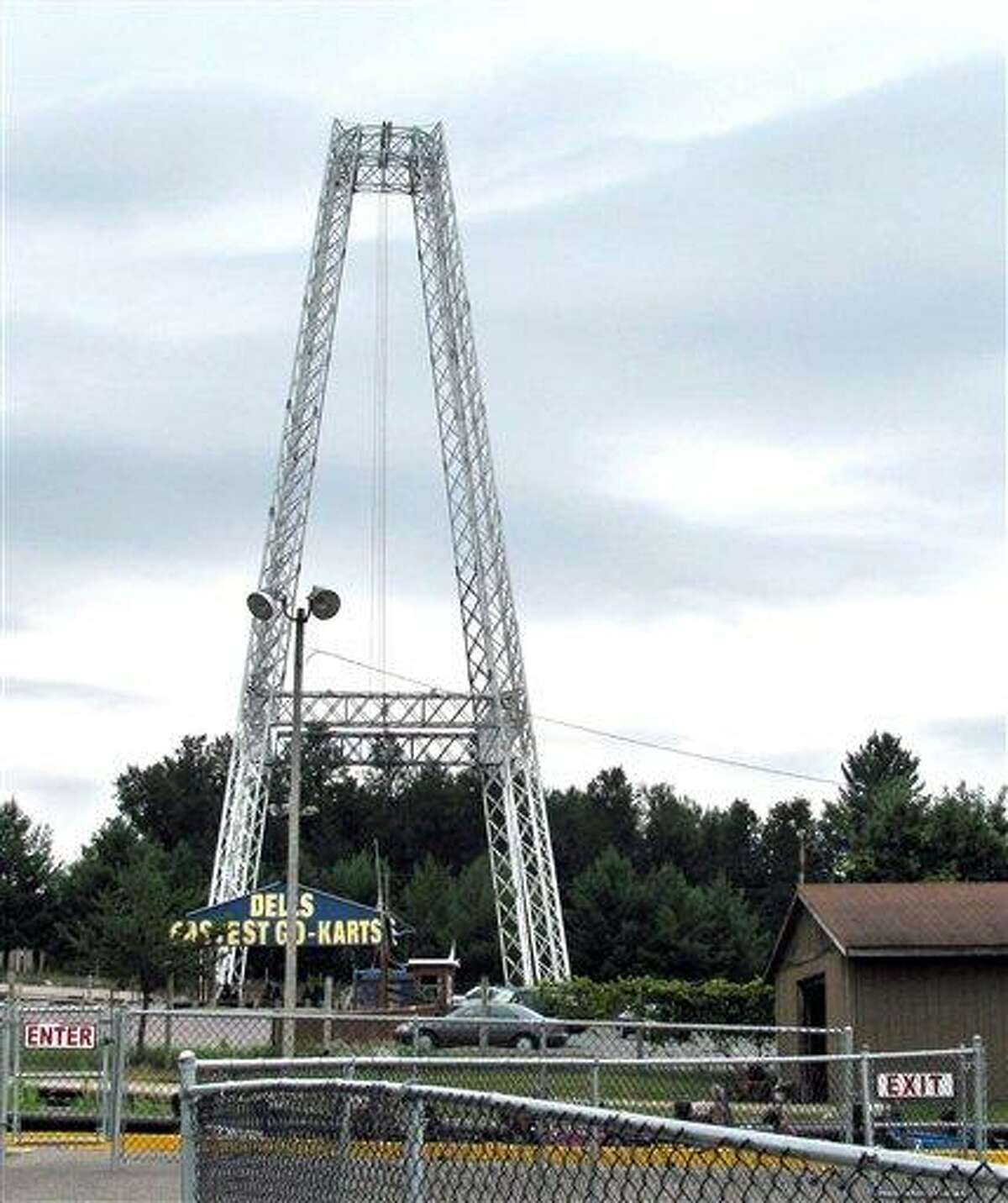 In this July 30, 2010, file photo is the Terminal Velocity free-fall ride at Extreme World in Lake Delton, Wis. An amusement park worker "blanked out" and never say an all-clear signal before he let a Florida girl plunge 100 feet to the ground. Charles A. Carnell, of Lake Delton, was charged Wednesday with one count of first-degree-reckless injury, a felony punishable by up 25 years in prison and $100,000 in fines in the July 30 incident. (AP Photo/Wisconsin State Journal, Gena Kittner, File)