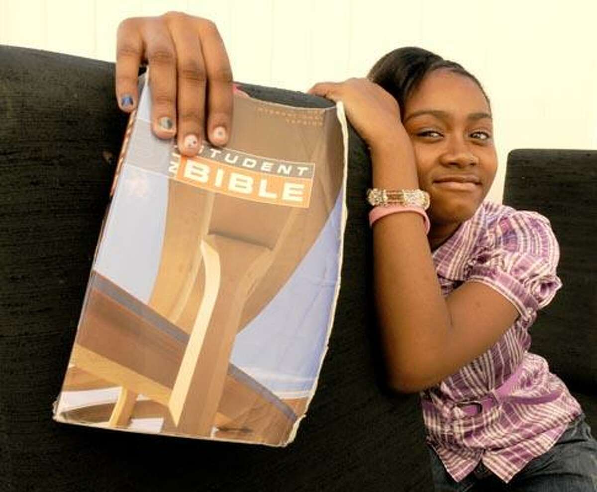 Photography by Peter Hvizdak/Register. Hanaisha Lewis, a sixth grader at Conte West Hills school, 11, says she has been bullied by other girls in the school and her teachers and principal don't want to do anything about it. One of her mainstays through this struggle, she says, is her Bible and her favorite verse, Luke 10:19.