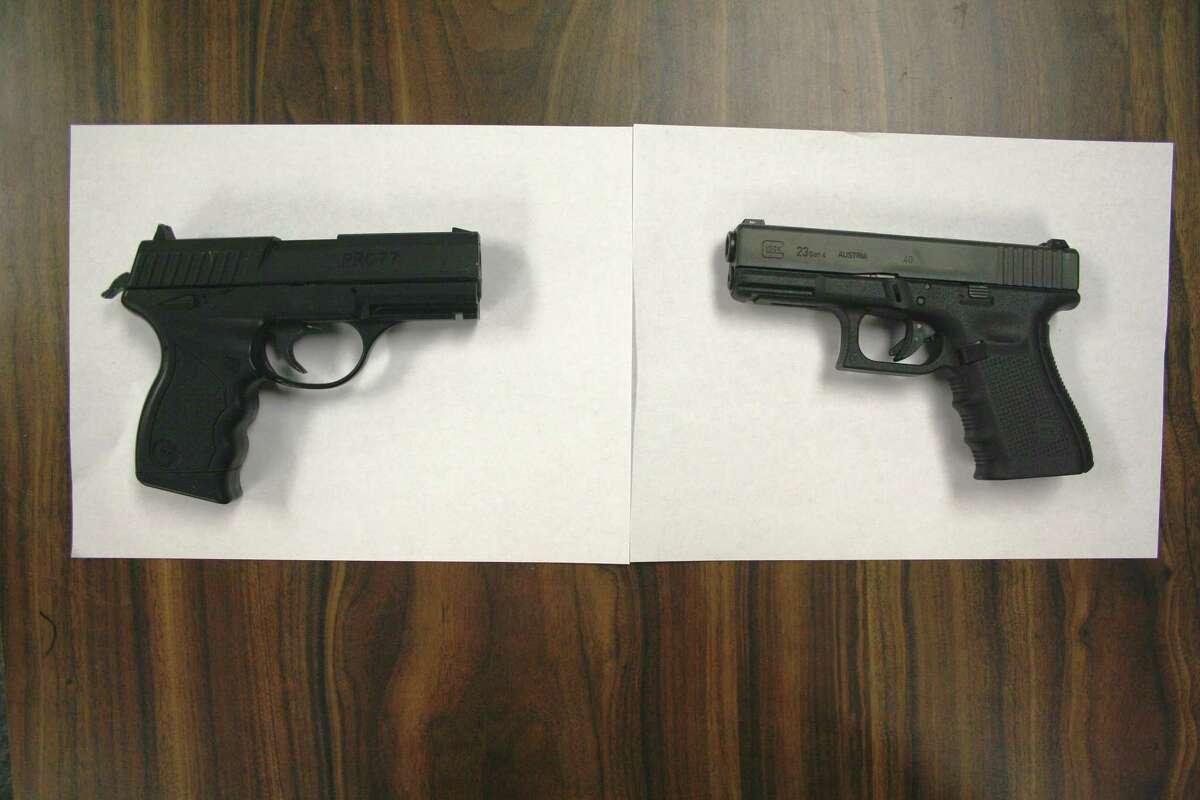 The gun at left is facsimile firearm that was pointed at Officer Katz. At right is a police issued .40 caliber semi-automatic pistol.
