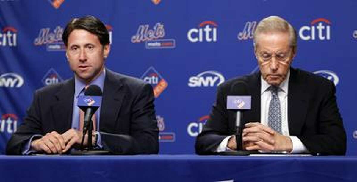 New York Mets owner and CEO Fred Wilpon, right, and COO Jeff Wilpon are in the process of conducting interviews for the vacant general manager position. (AP file photo)