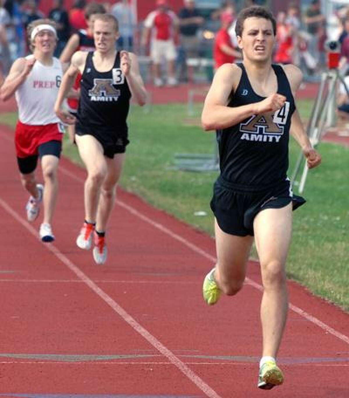 6/3/10 2LL TrackML0606NManchester High School, Class LL track championships: 1600M mens final won by Amity's John Cocco right, second was teammate Ryan Laemel, and third was Fairfield Prep's Connor Rog left. Photo by Mara Lavitt