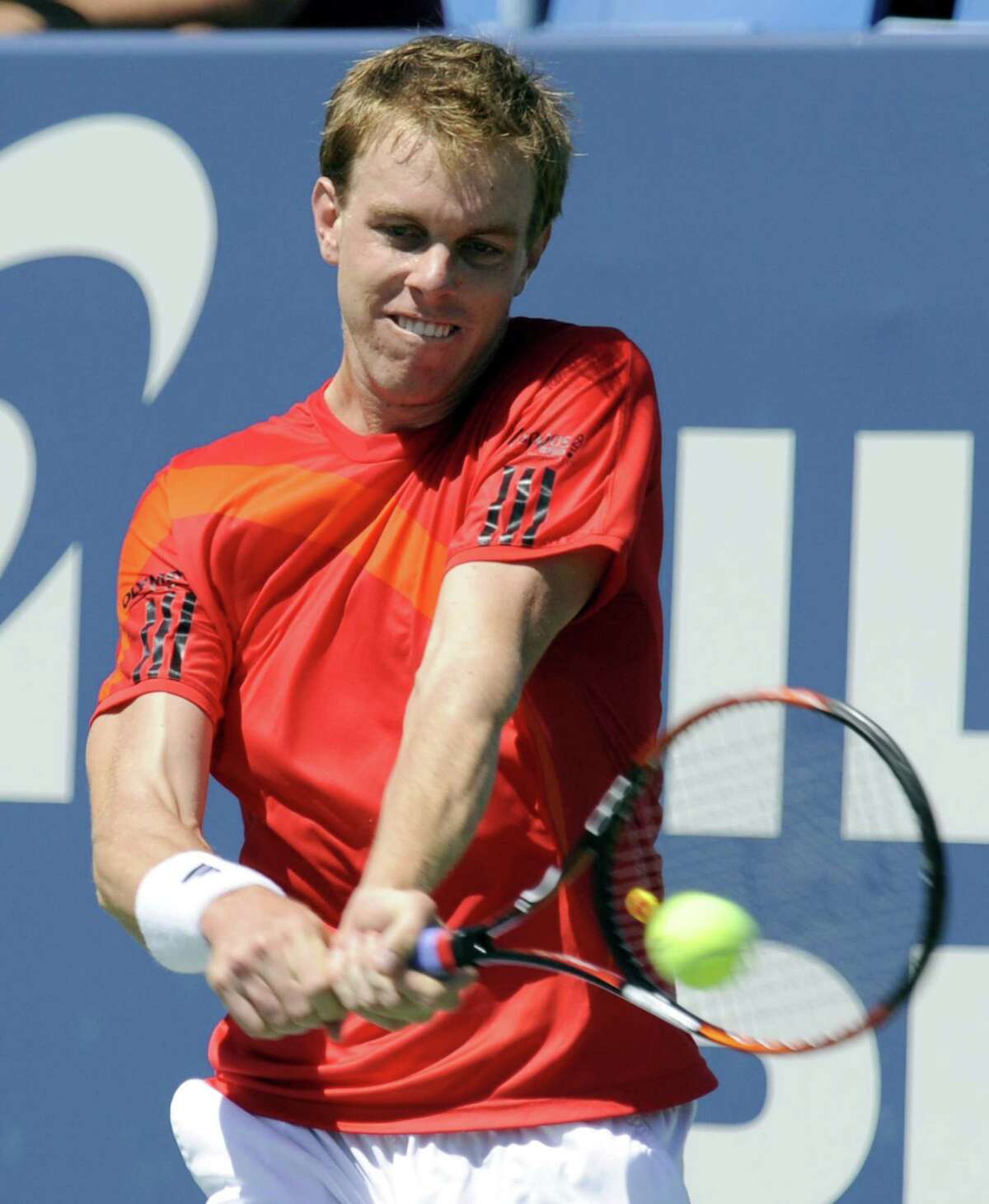Sam Querrey of the United States, hits a backhand return to Russia's Nikolay Davydenko during the Pilot Pen tennis tournament in New Haven, Conn., Thursday, Aug. 27, 2009. (AP Photo/Bob Child)