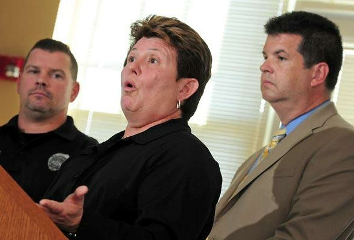 West Haven police Detective Mary Canfield, center, flanked by Officer Bret Schneider, left, and Detective Brian Reilly, speaks about Wednesday's arrest of Alonso Geminiano, during a press conference at police headquarters. (Brad Horrigan/Register)