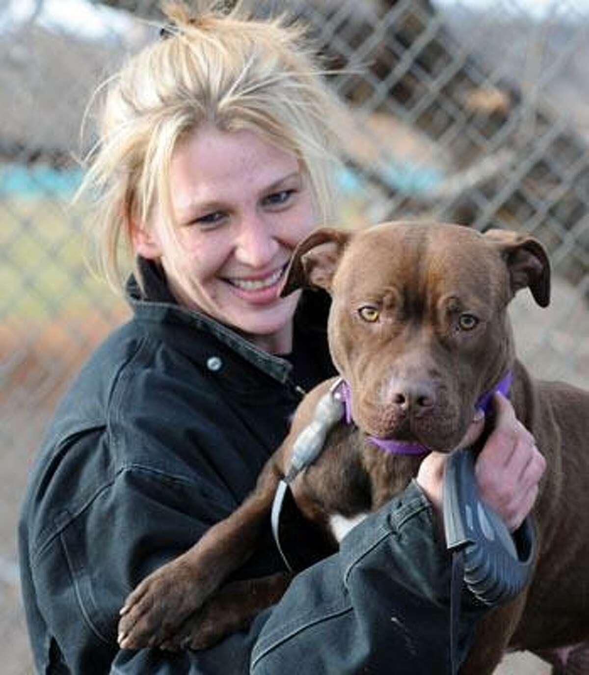 Milford Animal Control animal caregiver Cindy Schultz with Ginger, a pit bull the Shelter is trying to place. (Mara Lavitt/Register)