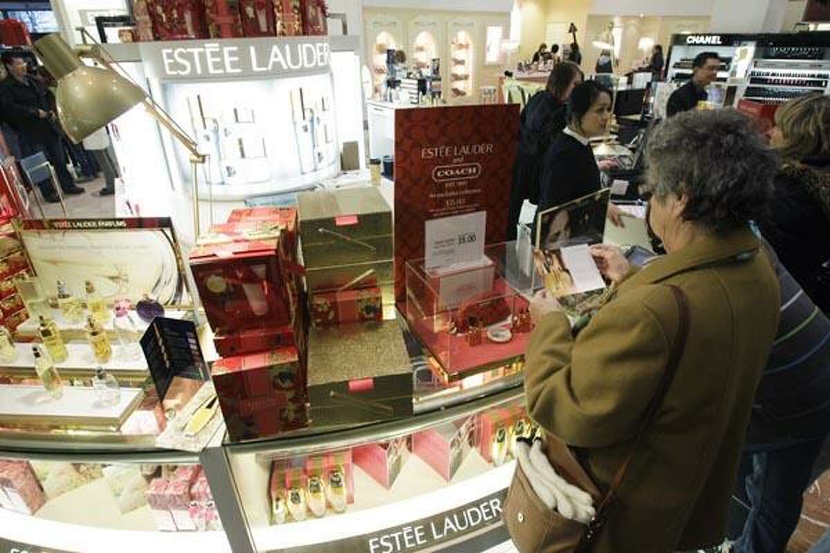 In this Nov. 26, 2010 photo, the Estee Lauder counter is shown in the Macy's store in downtown Seattle on Friday, Nov. 26, 2010. Several companies that peddle affordable luxury goods are reporting stronger-than-expected earnings, suggesting shoppers are making modest splurges. (AP Photo/Ted S. Warren)