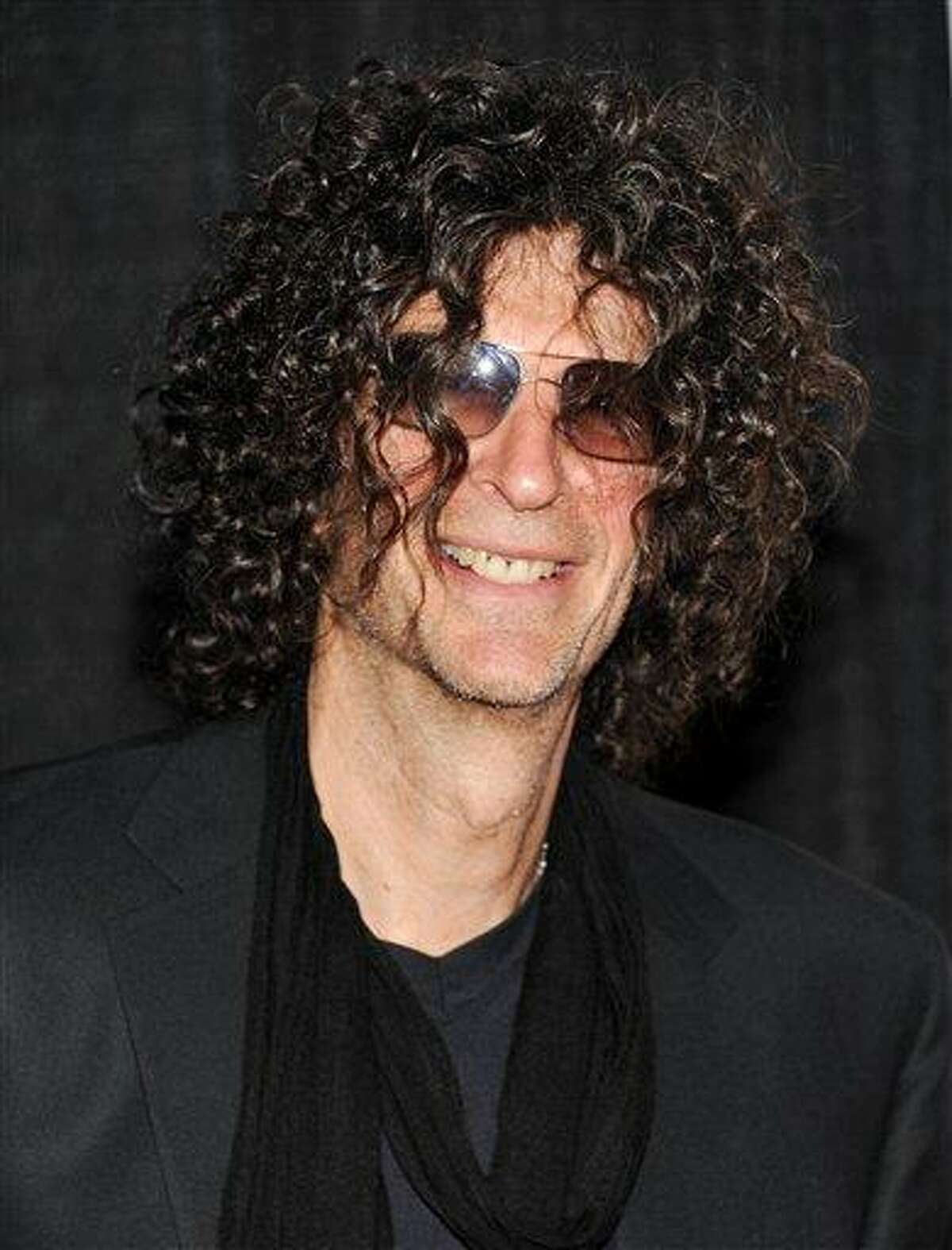 FILE - In a Dec. 1, 2010 file photo, Howard Stern attends the Quentin Tarantino Friars Club Roast at the New York Hilton Hotel in New York. Stern announced Thursday, Dec. 9, 2010 that he has signed a new 5-year contract with SiriusXM Radio. (AP Photo/Evan Agostini)