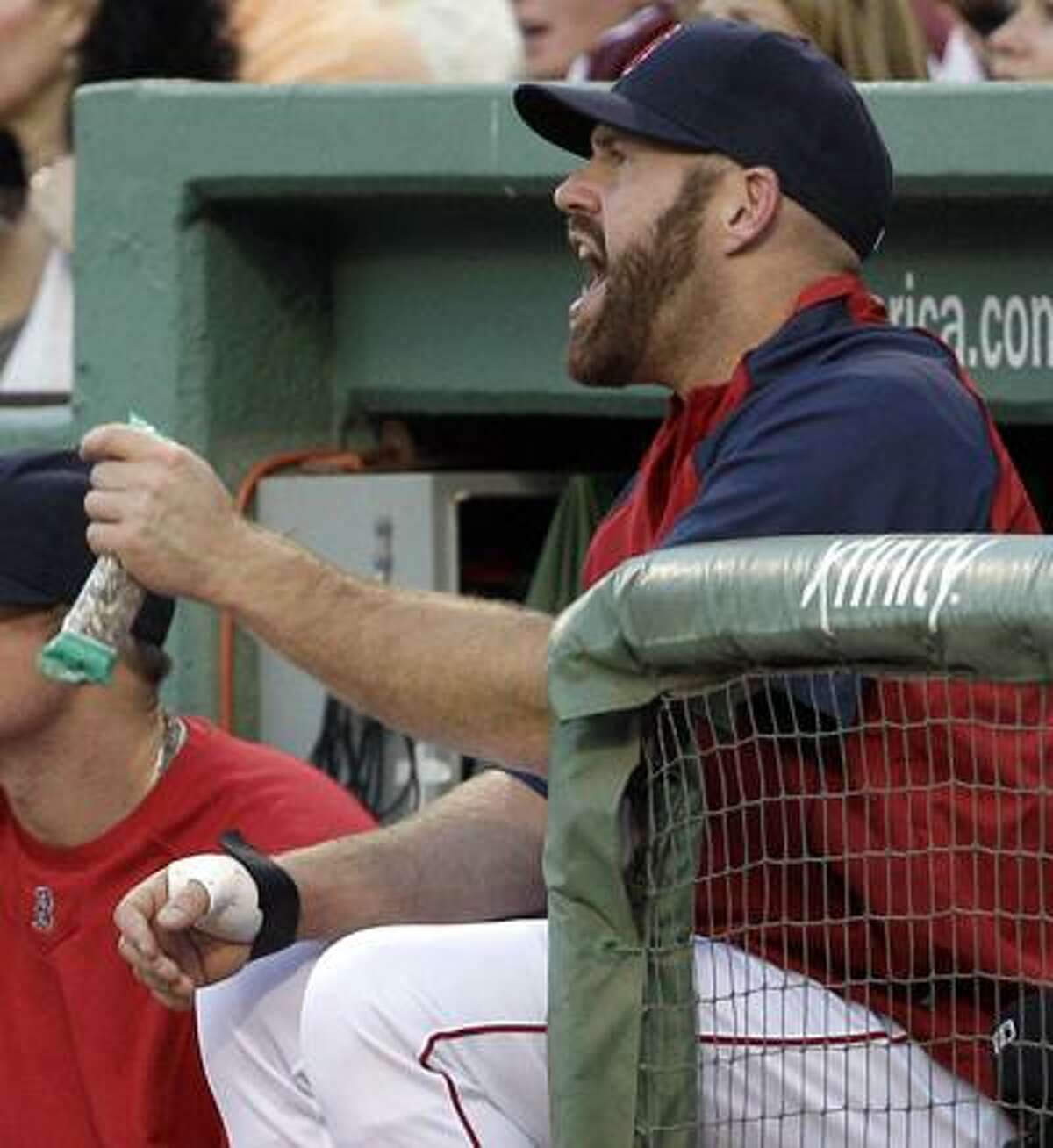 Boston's Kevin Youkilis will undergo surgery on his right hand Friday and miss the remainder of the season. (Associated Press/Elise Amendola)