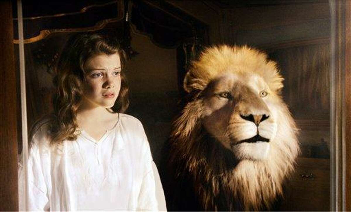 In this film publicity image released by 20th Century Fox, Georgie Henley and Aslan the Lion are shown in a scene from, "The Chronicles of Narnia: The Voyage of the Dawn Treader." (AP Photo/20th Century Fox, Phil Bray)