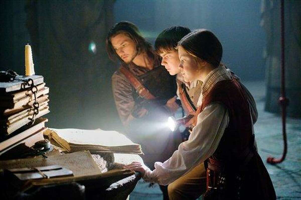 In this film publicity image released by 20th Century Fox, from left, Ben Barnes, Skandar Keynes and Georgie Henley are shown in a scene from, "The Chronicles of Narnia: The Voyage of the Dawn Treader." (AP Photo/20th Century Fox, Phil Bray)