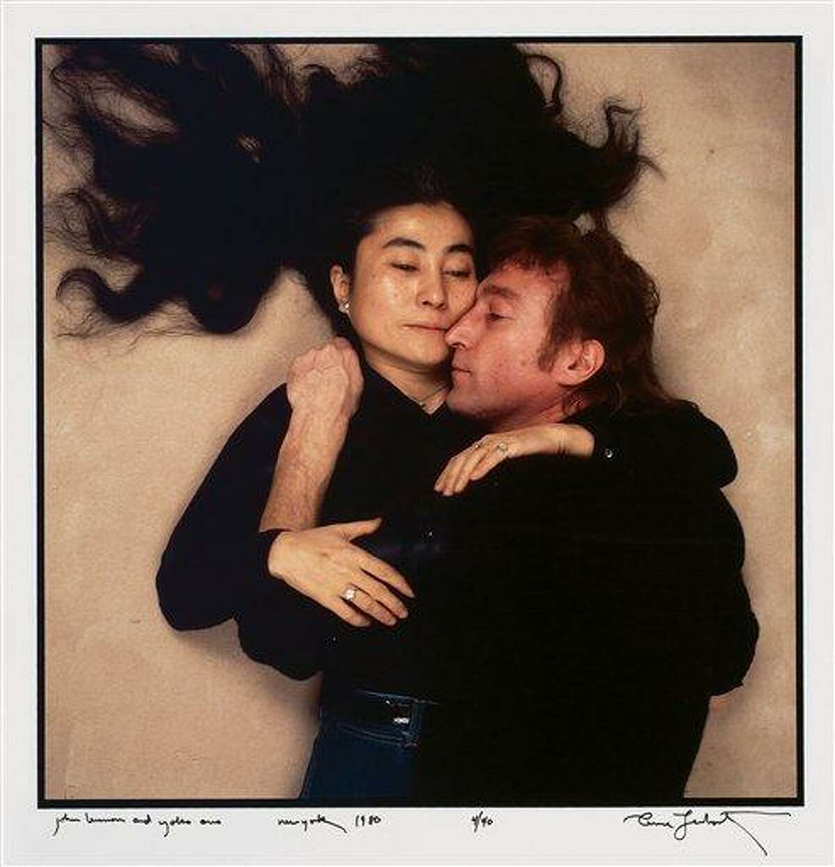This photo provided by Swann Auction Galleries shows John Lennon and Yoko Ono in December 1980 on the last day of Lennon's life. An original copy of the photograph, taken by Annie Liebovitz for Rolling Stone magazine, will be auctioned on Oct. 19, 2010 in New York. (AP Photo/Swann Auction Galleries, Annie Liebovitz) NO SALES
