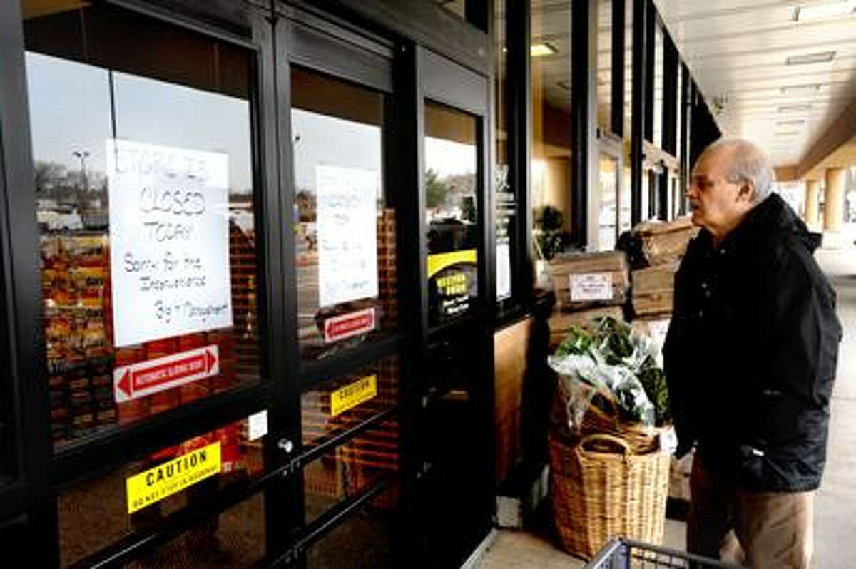 Joe Amarante is stopped short at the doors of the Branford Short Beach Big Y as he discovers the supermarket was closed for much of the day Monday due to a fire. VM Williams
