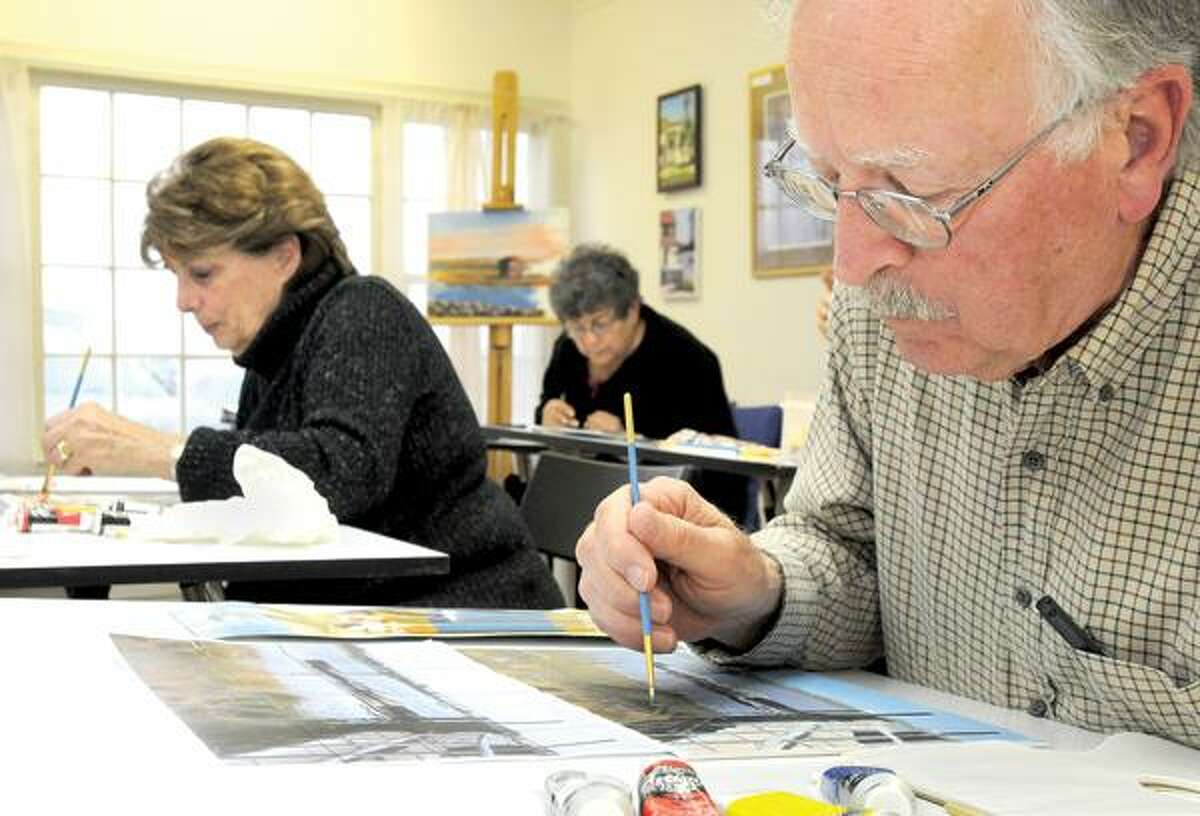 Joan Young, left, Rae Maselli and Julian Erde are taking the "How to Draw Straight Lines" course at the New Artists' View Learning Center in Madison. (Brad Horrigan/New Haven Register)