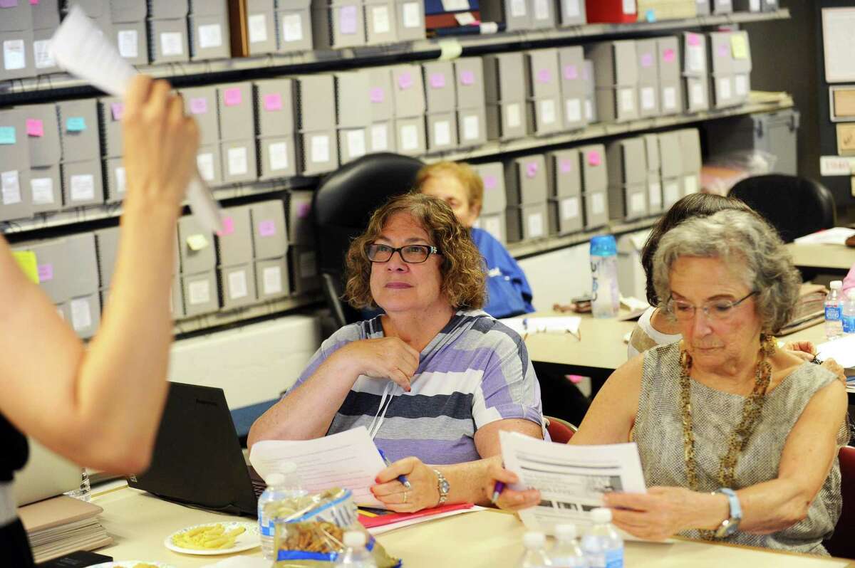 Sandy Golove (left), of Stamford, and Elaine Marks, of Greenwich, listen to Janeen Bjork lead a genealogical workshop at the Jewish Historical Society of Fairfield County on Hope Street in Stamford, Conn. on Wednesday, July 26, 2017.