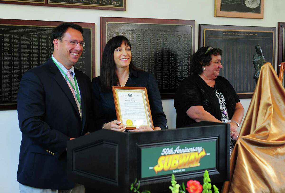 Milford Mayor Ben Blake presents a proclamation to Subway CEO Suzanne Greco at Subway’s 50th anniversary celebration at the world headquarters in Milford. Hundreds of employees gathered to celebrate the business and its humble beginnings in Bridgeport in 1965.