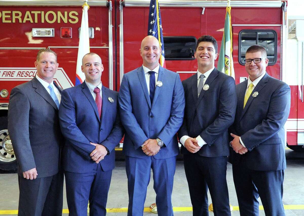 The five new Greenwich Firefighters from left, Stephen Brennan, Connor Johnson, Peter Purcell, Nicholas Salvador and Brian Stevens, after their swearing-in ceremony at Fire Department Headquarters in Greenwich, Conn., Friday morning, July 28, 2017.