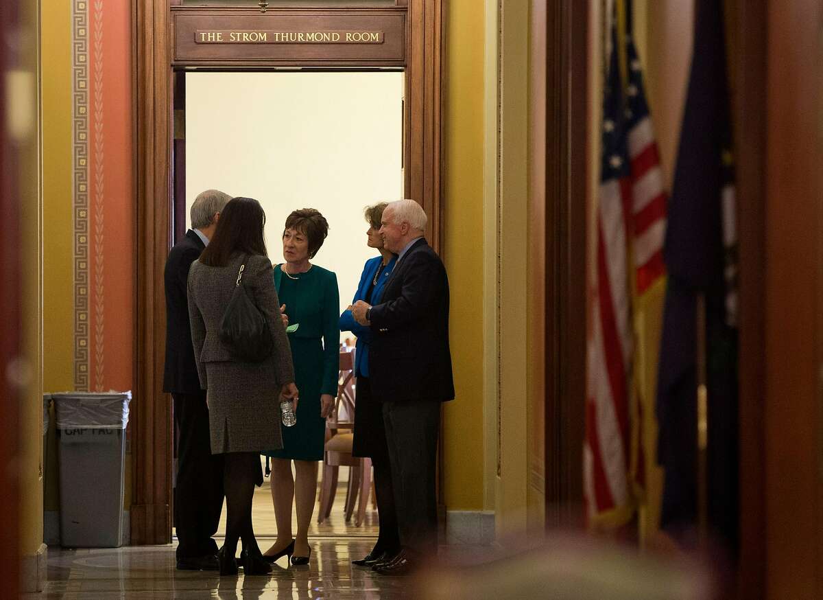 Sen. Susan Collins, R-Maine, center, talks with, from left, Sen. Rob Portman, R-Ohio, Sen.. Kelly Ayotte, R-N.H., Collins, Sen. Lisa Murkowski, R- Alaska, and Sen. John McCain, R- Ariz., on Capitol Hill in Washington, Friday, Oct. 11, 2013. House Republicans are offering to pass legislation to avert a default and end the 11-day partial government shutdown as part of a framework that would include cuts in benefit programs, officials said Friday. (AP Photo/ Evan Vucci)