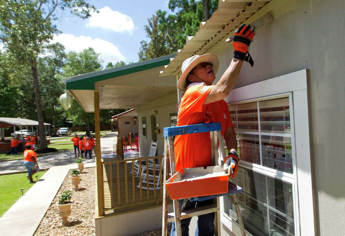 Phil Schiffman works on painting a cottage at Hope Cancer Retreat, Thursday, July 27, 2017, in Splendora. Ten Home Depot stores gathered at the non-profit to work on various projects from landscaping to painting. The organization offers housing to those seeking cancer treatment in Houston for $25 a night for up to three months.