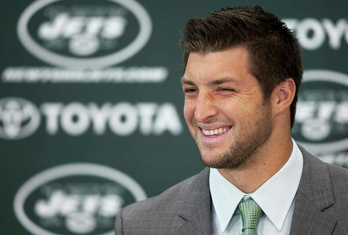 Tim Tebow holds his first news conference with the New York Jets, Monday, March 26, 2012, in Florham Park, N.J. Tebow, who led the Denver Broncos to the playoffs last year, was acquired in a trade Wednesday with Denver and will serve as the backup quarterback to Mark Sanchez. (AP Photo/Mark Lennihan)