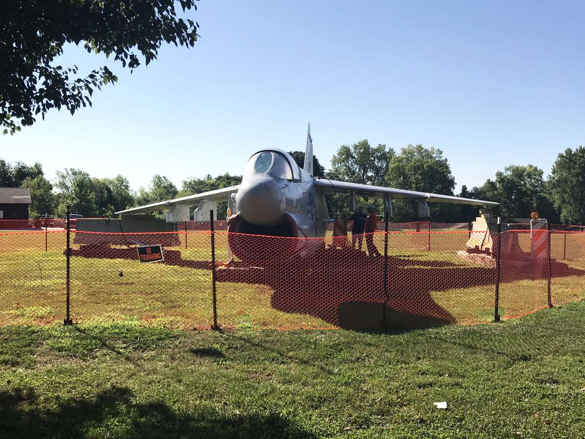 Volunteers Larry Kurwicki, of Glen Carbon, and Michael Blair, of Edwardsville, met this morning to continue restoring Township Park's U.S. Navy A7E Corsair II. Restoration officially began in June and the plane was lowered by Keller Construction in May. There is no set completion date as of yet. 