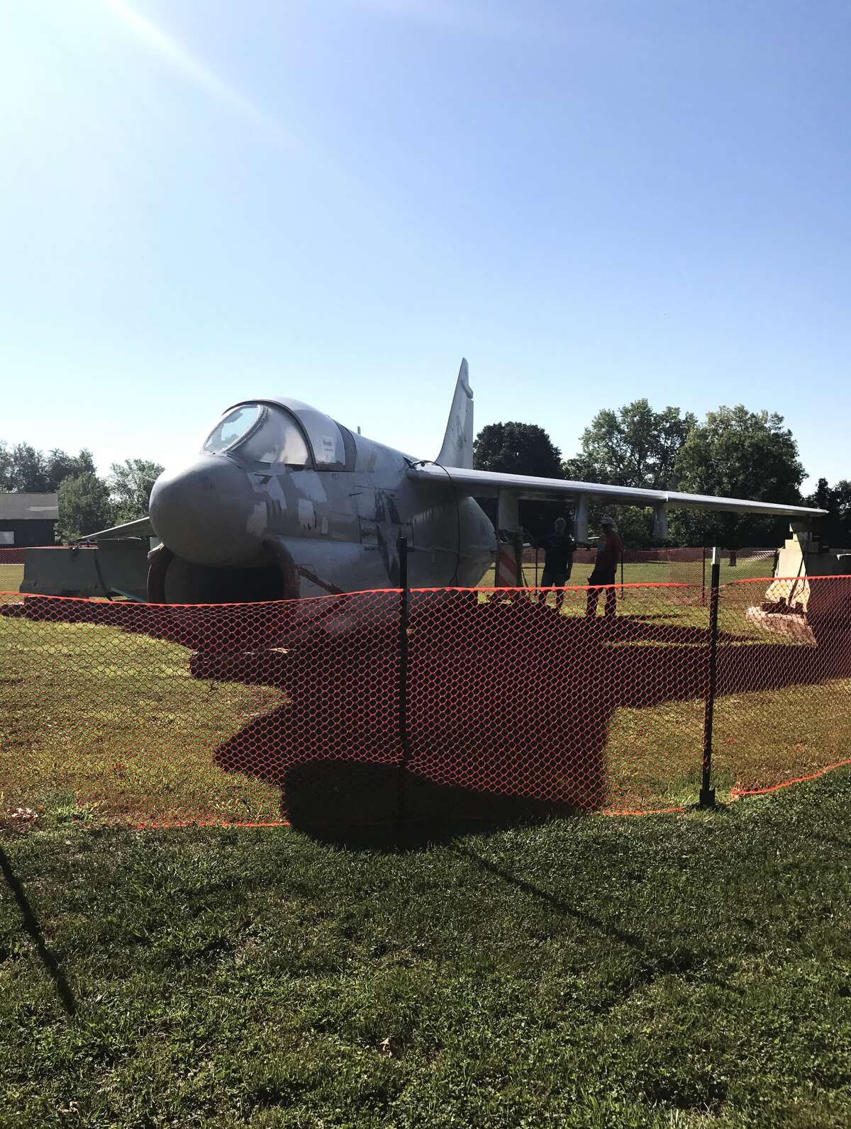 Volunteers contribute to the airplane restoration project at Township Park Saturday morning. The plane restoration officially began in June.