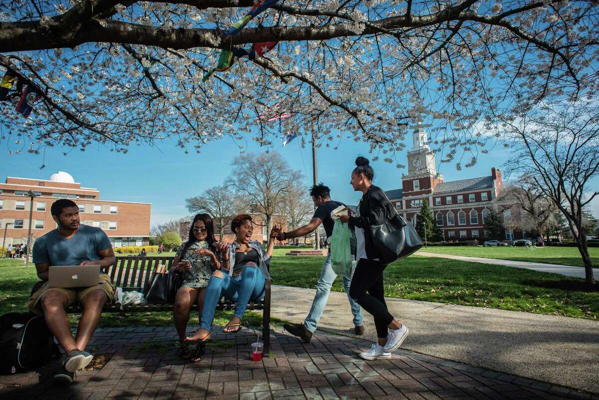 Howard University students socialize between classes. Howard is among the historically black colleges founded by white Americans.