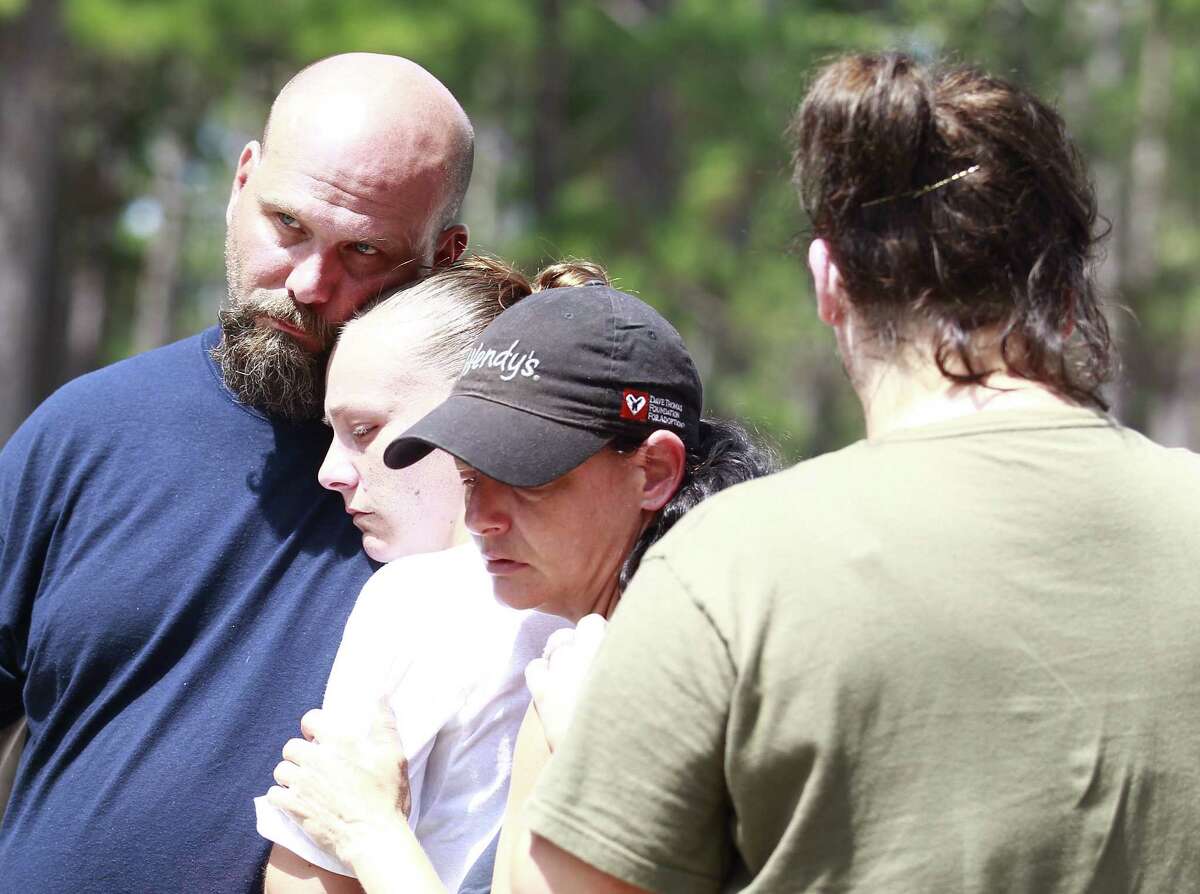 Michael Kiser (left) and his family mourn the death of his sister, Theresa Kirkpatrick, who went missing Friday﻿.﻿