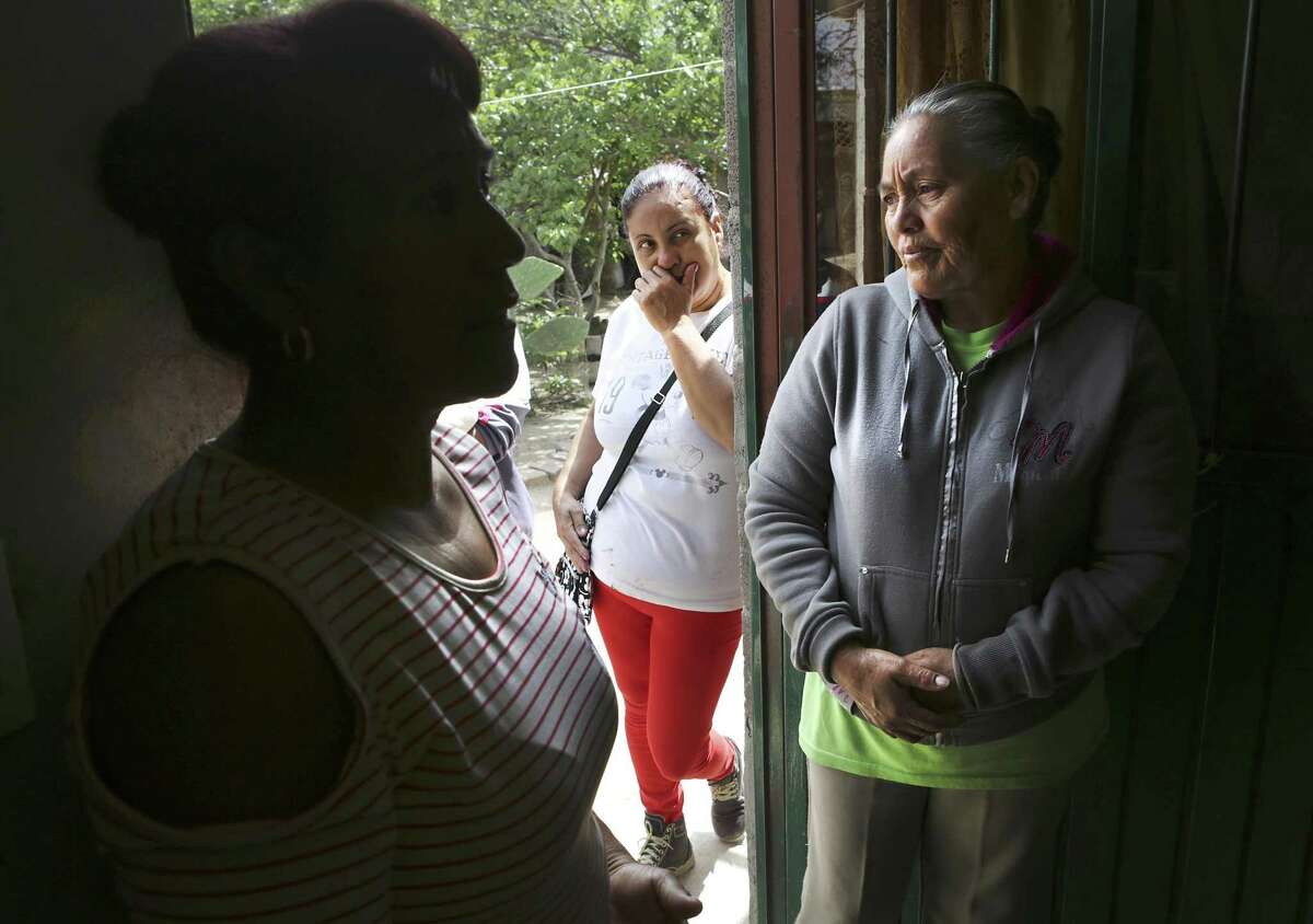 Lourdes Vega Tiscareno, right, mother of Adan Lara Vega who was a victim in the human smuggling trailer, Yolanda Guerrero Gutierres, center, Adan's aunt, and Rosalba Vega Tiscareno, left, another aunt, discuss Adan's situation, in Palo Alto El Llano, Mexico, a small town east of Aguascalientes, on Thursday, July 27, 2017.