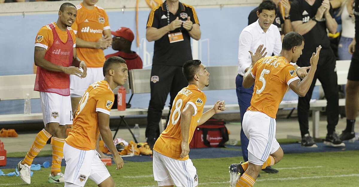 6/29/17: Houston Dynamo forward Mauro Manotas (19) and midfielder Memo Rodriguez (18) celebrates midfielder Juan Cabezas (5) goal against the Portland Timbers in the second half in a MLS game at BBVA stadium in Houston, TX. The score ended in a 2 to 2 draw.